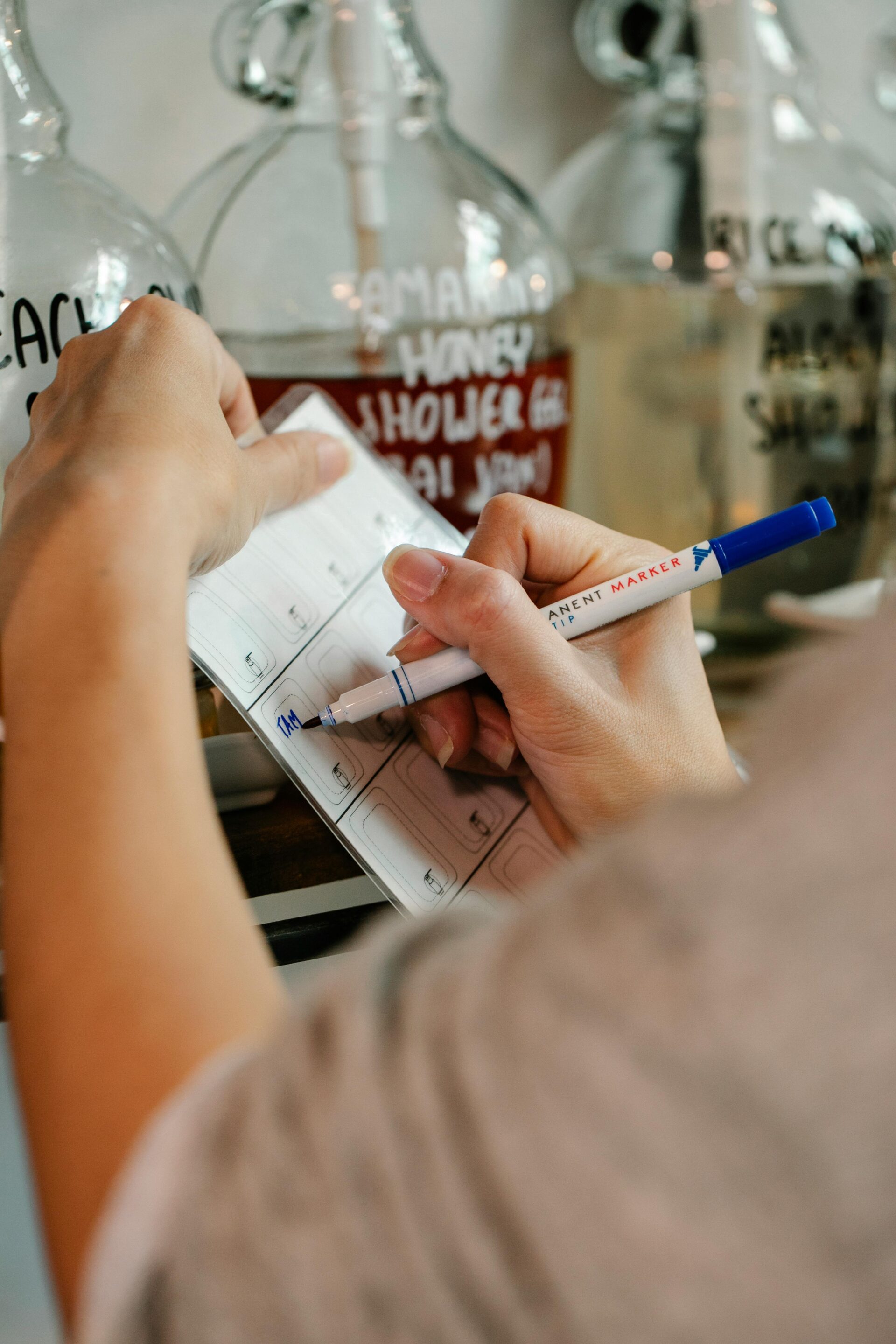 Healthcare professional writing a Nursing SOAP Note in a clinical setting.